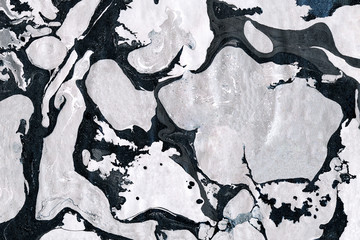 Silver and black marbling wallpaper.