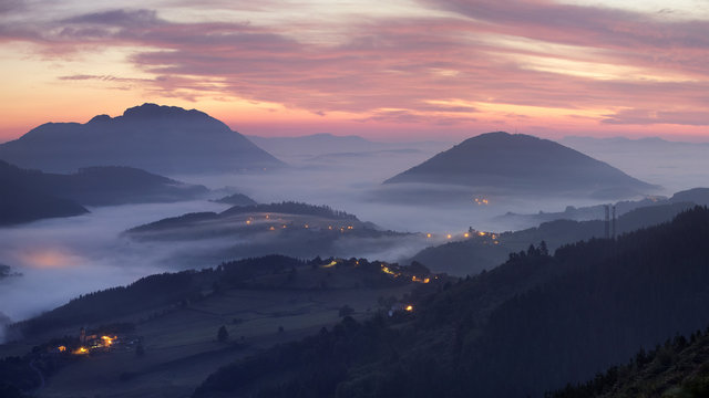 Amazing sunrise over Aramaio valley covered by mist