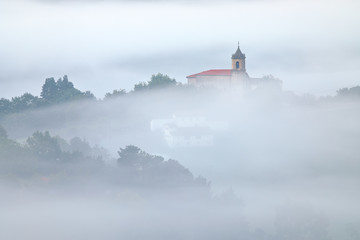 Bedona village covered by the mist (Arrasate, Mondragon, Gipuzkoa, Basque Country)