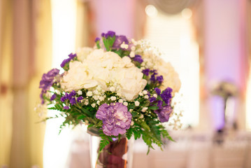 white Hydrangea and Purple Carnations Wedding Centerpiece