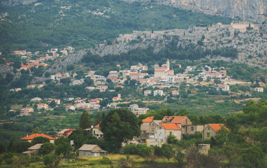 Fototapeta na wymiar Fortress of Klis and old village in Croatia.