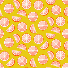 Grapefruit slices on yellow background. Citrus seamless vector pattern.