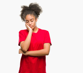Fototapeta na wymiar Young afro american woman over isolated background thinking looking tired and bored with depression problems with crossed arms.