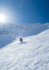 Fototapeta na wymiar backcountry snowboarder in the mountains in norway