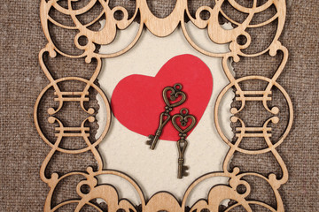 Fototapeta premium Vintage wooden frame with the decor on sacking.