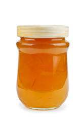Homemade orange jam in glass jar isolated on white background