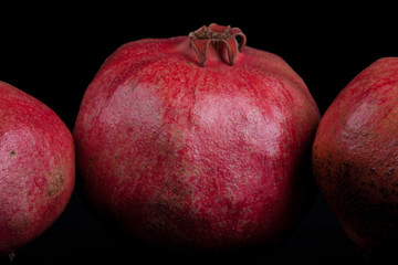 pomegranates on a black background