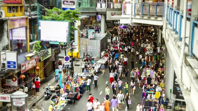people shopping at street market Bangkok urban Sukhumvit road time lapse shot
