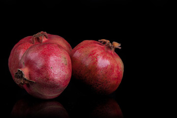 pomegranates on a black background