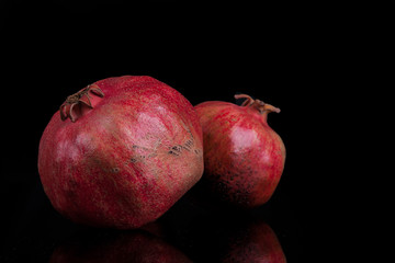 pomegranates on a black background