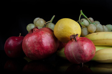 pomegranates on a black background