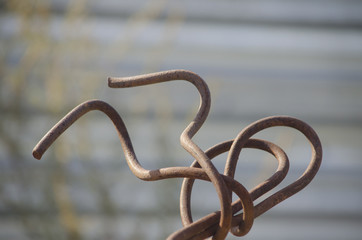 Old rusty armature, figuratively curved into an interesting figure
