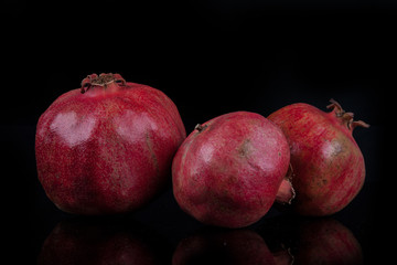 pomegranates on a black background