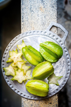 Juicy carambola on a metal plate
