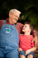 Happy Great Grandfather and Great Grandson Sitting Together