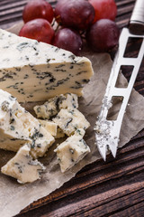 delicious blue cheese on wooden rustic background