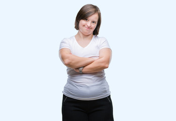 Fototapeta premium Young adult woman with down syndrome over isolated background happy face smiling with crossed arms looking at the camera. Positive person.