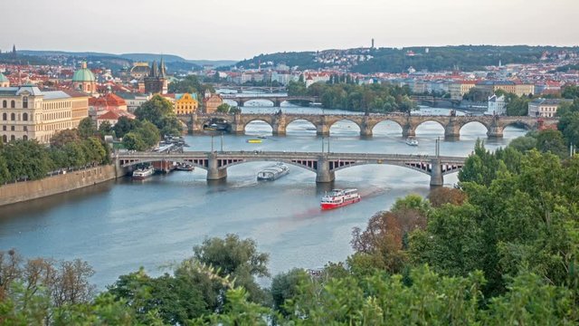 Bridges of Prague including the famous Charles Bridge over the River Vitava Czech Republic at sunset, time lapse. day to night. Europe