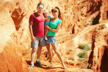 a family with a child in the mountains
