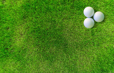 Two Golf Balls Lying on Green Grass View from Above