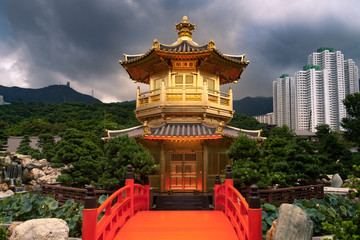 Golden Temple in Hong Kong Nan Lian Garden with Stormy clouds