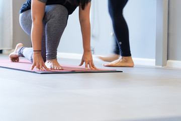 Young fat  woman practicing yoga with namaste behind the back.working out, wearing sportswear. and relax.