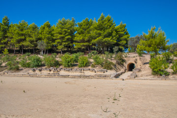 Stadium of the Panhellenic Games and the entrance tunnel from where the athletes enter to the stadium at archaeological site of Nemea in Greece
