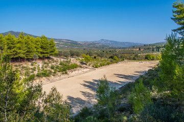 Stadium of the Panhellenic Games at archaeological site of Nemea in Greece. Nemea was a religious sanctuary in the northern Peloponnese where Panhellenic athletic games were held
