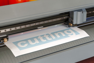 Cutting plotter close-up. The process of cutting a vinyl film.