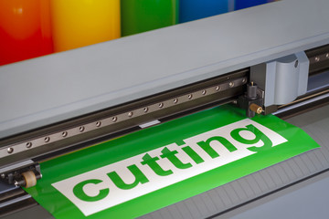 Cutting plotter close-up. The process of cutting a vinyl film.