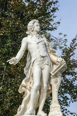 Fototapeta na wymiar The marmor statue of the great musician Wolfgang Amadeus Mozart in Vienna, Austria, (built in 1896)