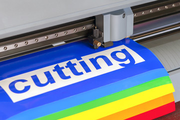 Cutting plotter close-up. The process of cutting a vinyl film.
