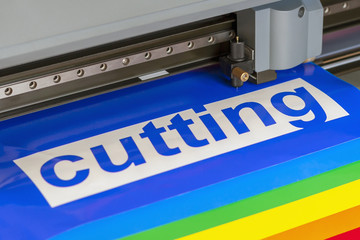 Cutting plotter close-up. The process of cutting a vinyl film.