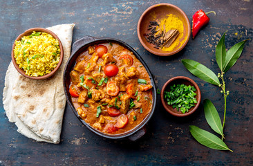 INDIAN FOOD. ROGAN JOSH curry sauce. Pork rogan josh with rice and naan bread
