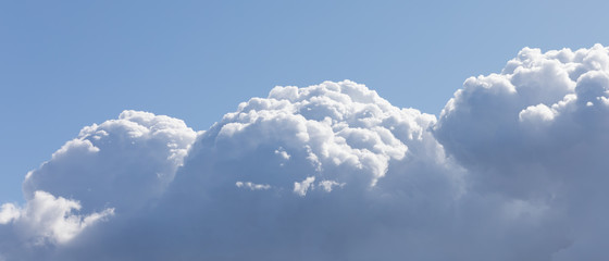 Fototapeta na wymiar Clouds in the form of three hills
