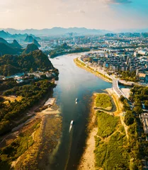 Foto op Plexiglas Aerial photo of a boat sailing down river Li in Guilin China © creativefamily