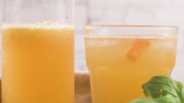 Fresh organic orange juice. Homemade citrus orange juice in glasses on table.