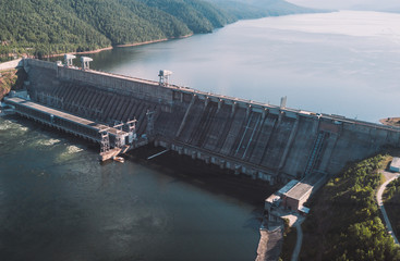 Krasnoyarsk hydroelectric station dam, hydro power plant on Enisey river from aerial view....