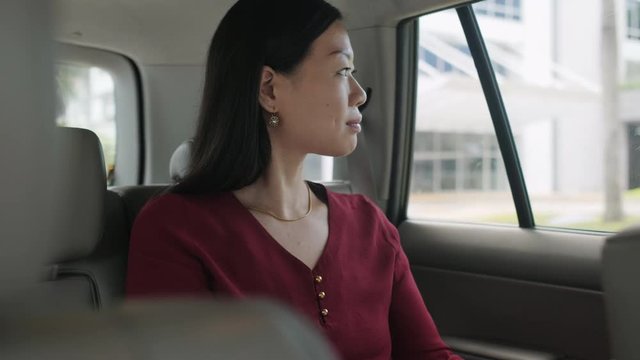 Chinese Business Woman Working In Taxi Going To Work