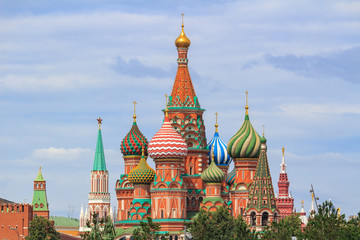Fototapeta na wymiar St. Basil's Cathedral on Red square against Moscow Kremlin on a cloudy summer day