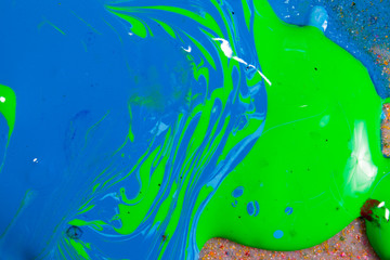 colorful of screen printing ink dropped on the ground made an abstract art