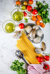 Ingredients for cooking Spaghetti with seafood. Shells musselsa, clams, vongole, tomatoes and white wine.