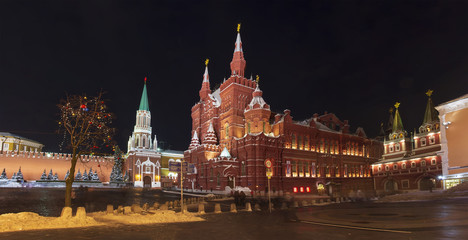 Kremlin and Historical Museum on the Red Square, Moscow, Russia in Christmas time. Winter night Moscow with festive decorations and shining night lights.
