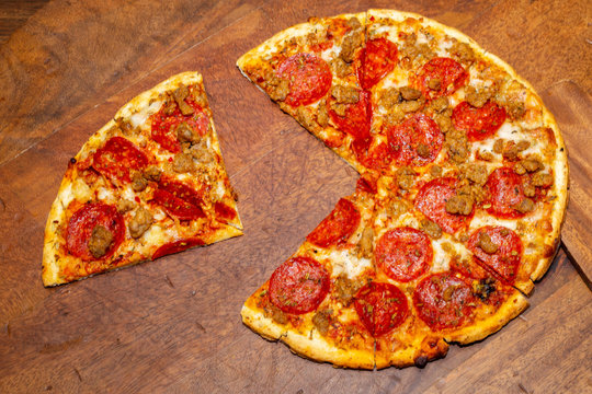 Pizza Pie With A Quarter Removed To Demonstrate Math Fractions.