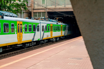 Electric passenger train arrives at the railway station in Warsaw Poland