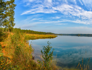 Artificial lake formed after the removal of sand. Closed sand quarry.