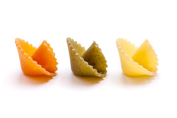 Pasta (in form of mashrooms) of three colors isolated on white background