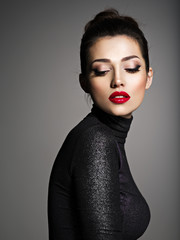 Beautiful young fashion woman with red lipstick.