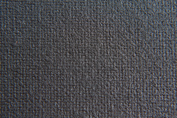 Сlose up of black sandpaper sheet texture, background or backdrop