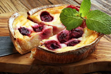 cheesecake cherry Dessert - Cheesecake with Berries Sauce and Green Mint.